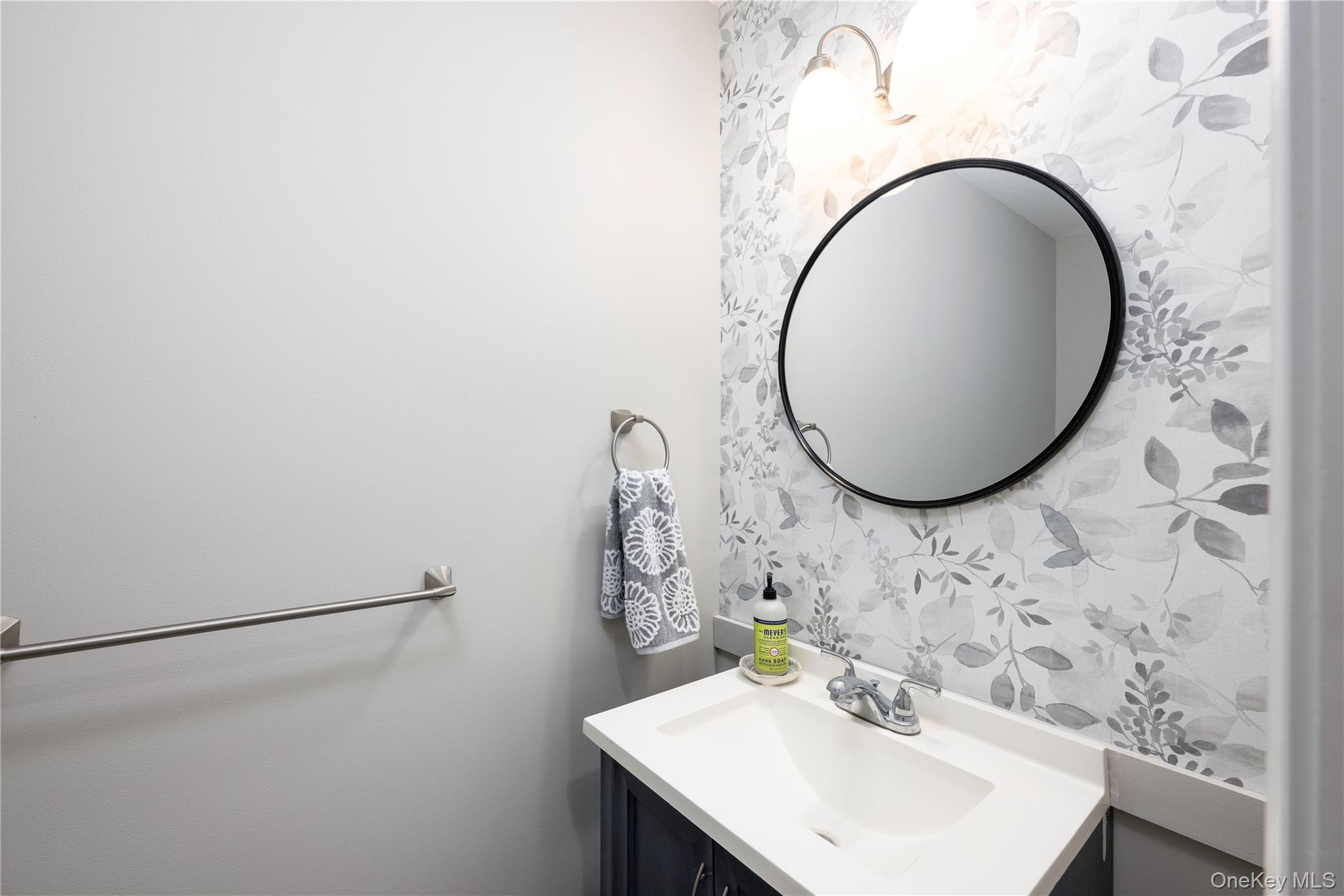 129 Stringham Road, Unit 31 LaGrangeville, NY 12540 - Photo 9 of 26 a bathroom with a sink and a mirror
