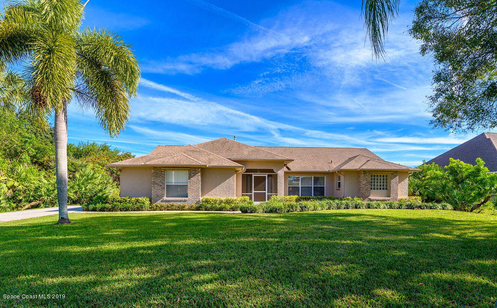 3525 Shady Run Road Melbourne, FL 32934 - Photo 1 of 32 a front view of a house with a garden