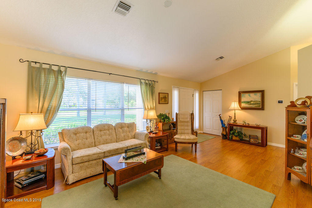 3525 Shady Run Road Melbourne, FL 32934 - Photo 12 of 32 a living room with furniture and a large window