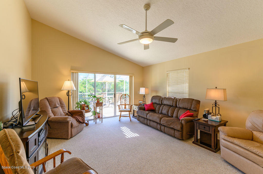 3525 Shady Run Road Melbourne, FL 32934 - Photo 18 of 32 a living room with furniture and a large window