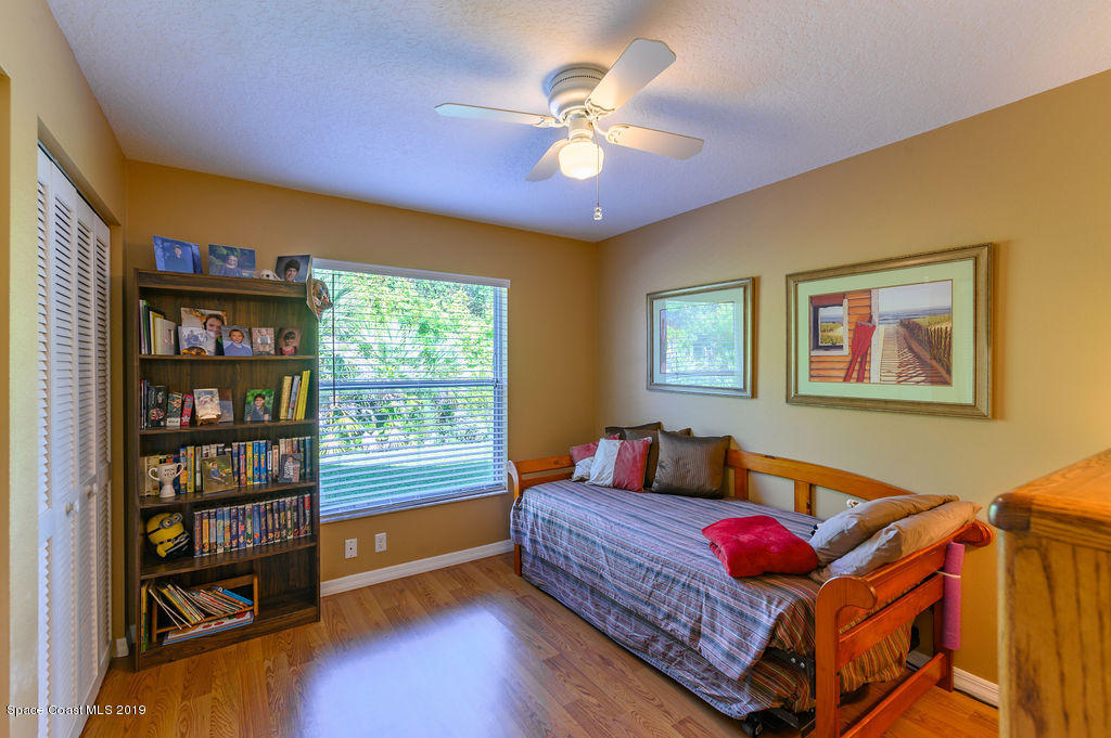 3525 Shady Run Road Melbourne, FL 32934 - Photo 20 of 32 a living room with furniture and a window