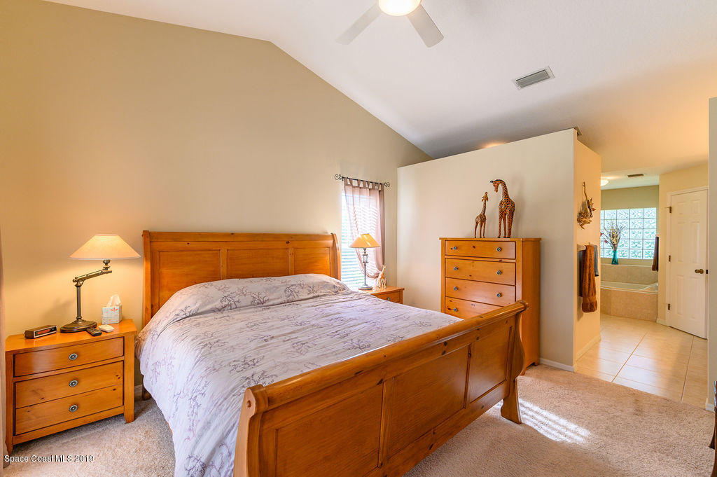 3525 Shady Run Road Melbourne, FL 32934 - Photo 24 of 32 a bedroom with a bed and a closet