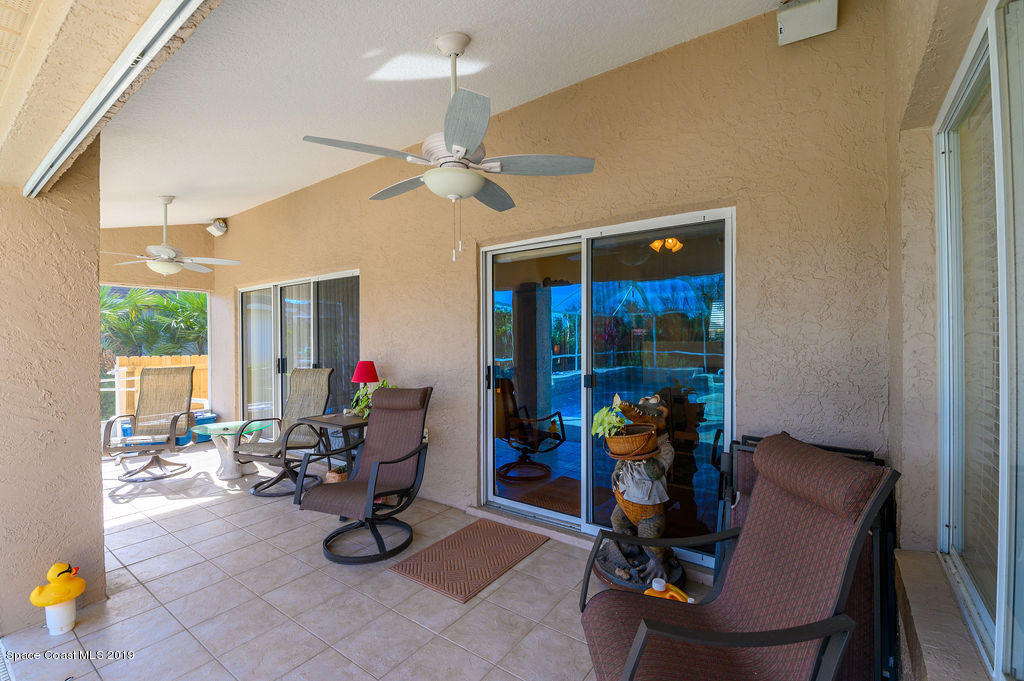 3525 Shady Run Road Melbourne, FL 32934 - Photo 29 of 32 a view of a workspace with furniture and a window