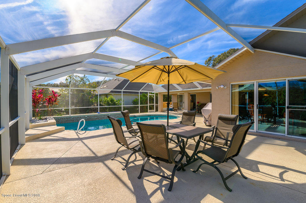 3525 Shady Run Road Melbourne, FL 32934 - Photo 30 of 32 a patio with table and chairs