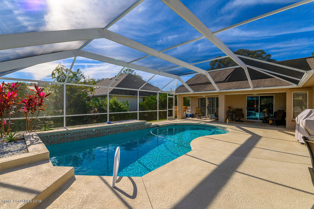 3525 Shady Run Road Melbourne, FL 32934 - Photo 31 of 32 a view of a backyard with swimming pool and sitting area