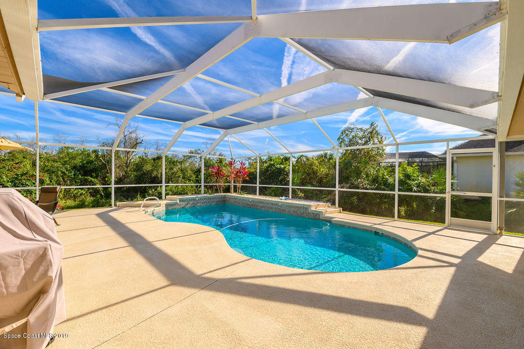 3525 Shady Run Road Melbourne, FL 32934 - Photo 32 of 32 a view of a backyard with a swimming pool