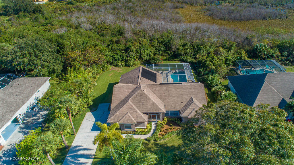 3525 Shady Run Road Melbourne, FL 32934 - Photo 5 of 32 an aerial view of a house with yard and outdoor seating