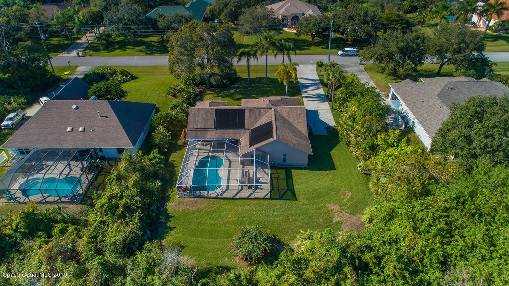 3525 Shady Run Road Melbourne, FL 32934 - Photo 6 of 32 an aerial view of a house with garden space and street view