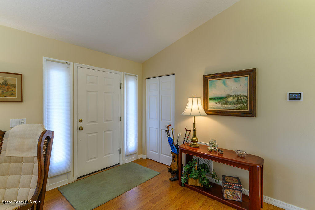 3525 Shady Run Road Melbourne, FL 32934 - Photo 10 of 32 a living room with furniture and wooden floor