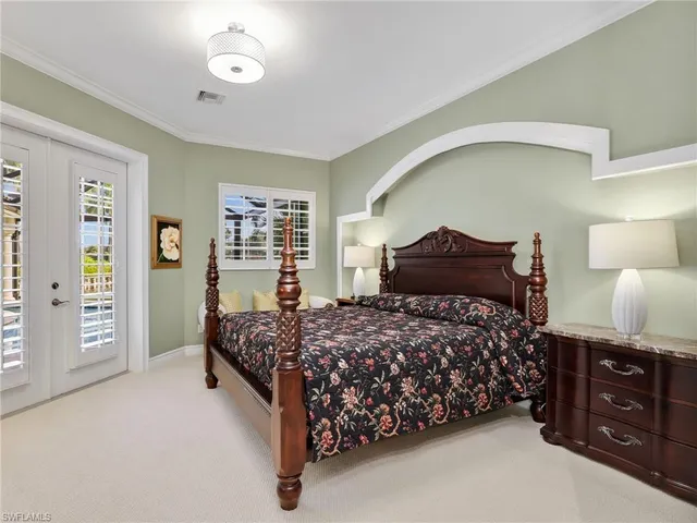 a bedroom with a bed and dresser
