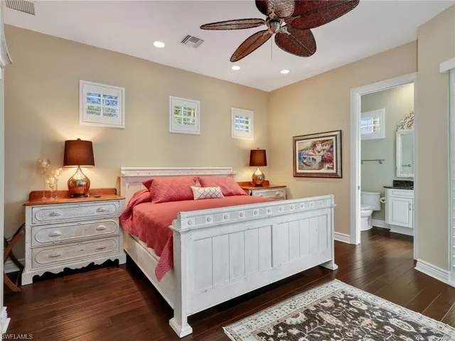 a bed room with a bed and a chandelier