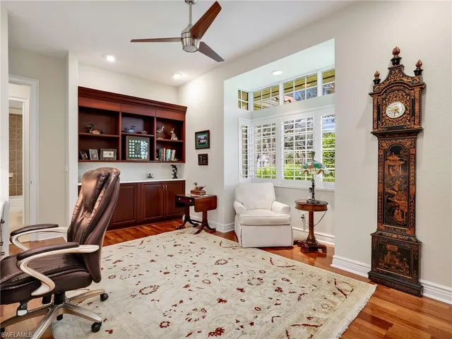 a bedroom with furniture and a window