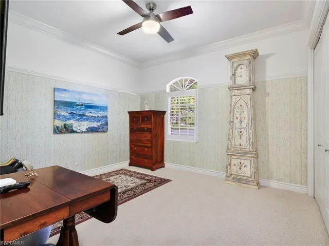 a view of workspace with hardwood floor and window