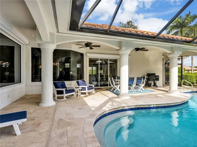 a view of a swimming pool with patio