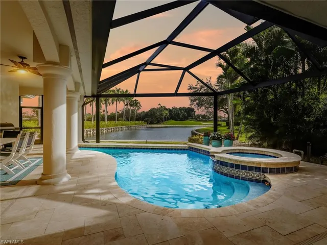 a view of a swimming pool with a sitting area