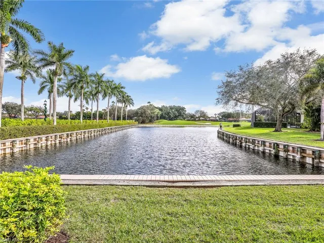 a view of a swimming pool and a yard