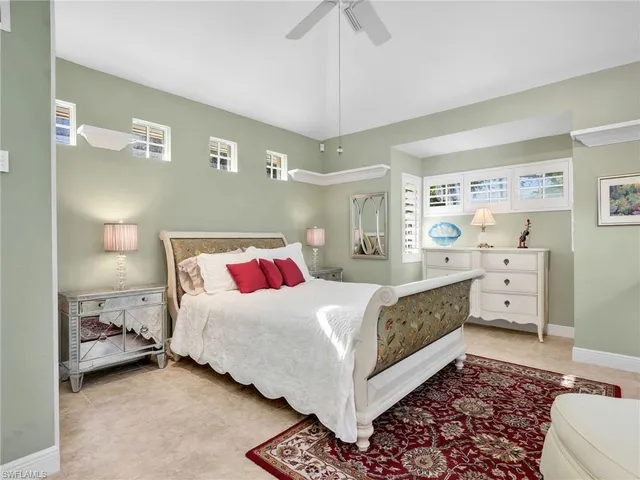 a bedroom with a bed and a cabinets