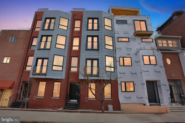 a front view of a multi story residential apartment building