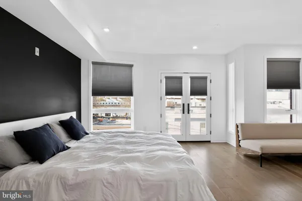 a bedroom with a large bed and a couch