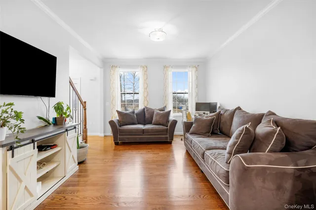 a view of a house with a big yard and large trees