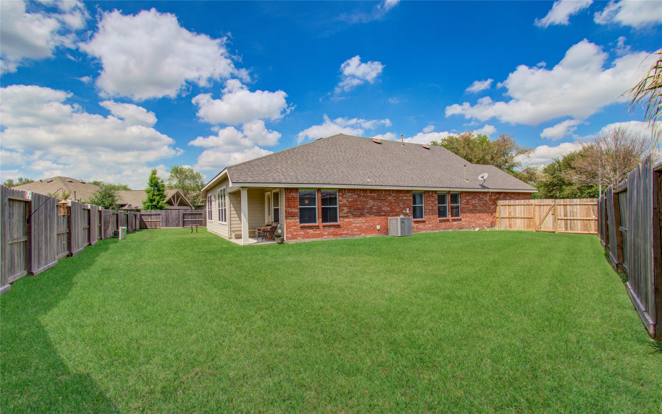 20007 Alcea Court Spring, TX 77379 - Photo 34 of 36 Large backyard with covered patio perfect for relaxing evenings.