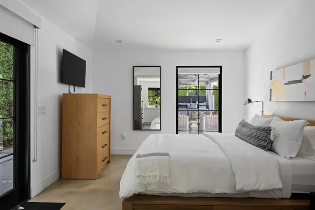 a bedroom with a bed and a table