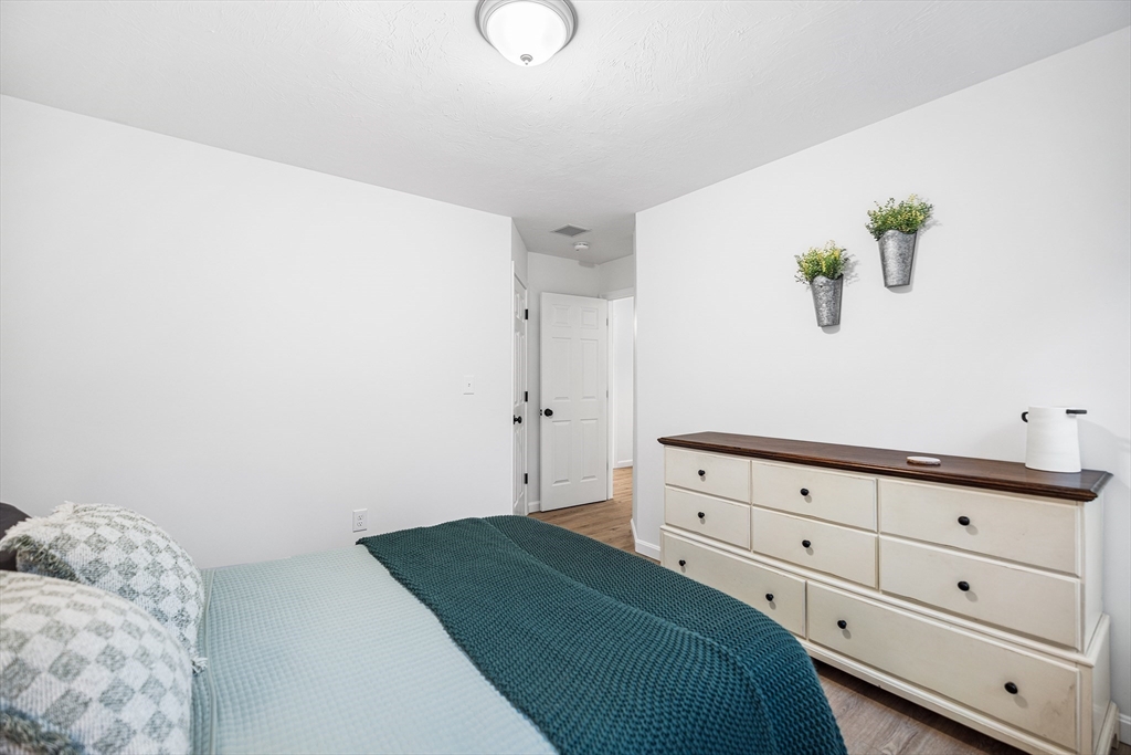 48 Walnut Street Douglas, MA 01516 - Photo 22 of 32 a bedroom with a bed and hallway