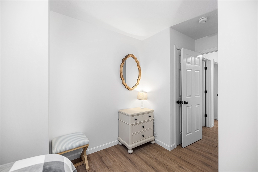 48 Walnut Street Douglas, MA 01516 - Photo 25 of 32 a bathroom with a toilet mirror and vanity
