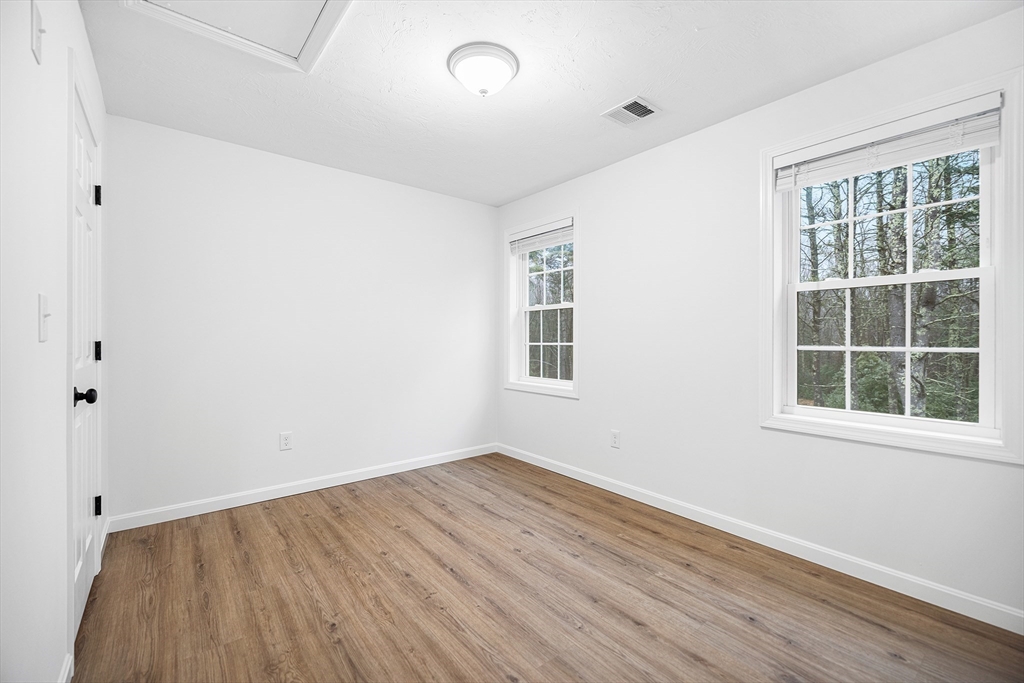 48 Walnut Street Douglas, MA 01516 - Photo 26 of 32 an empty room with wooden floor and windows
