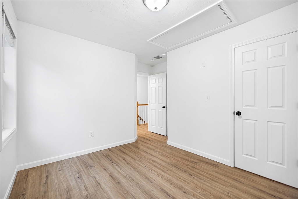 48 Walnut Street Douglas, MA 01516 - Photo 27 of 32 a view of an empty room with wooden floor