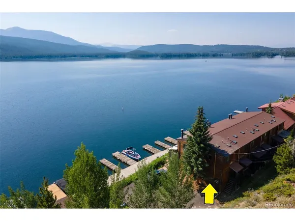 a aerial view of a house with a lake view