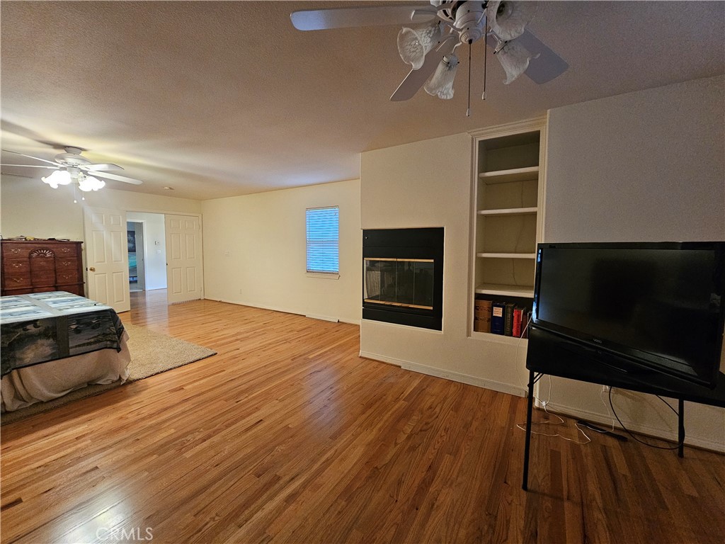 11541 Donovan Road Rossmoor, CA 90720 - Photo 17 of 51 Primary Suite - sitting area with corner fireplace
