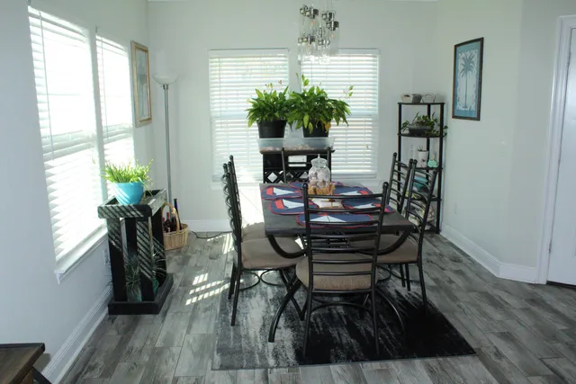 a bedroom with a large bed and a flat screen tv