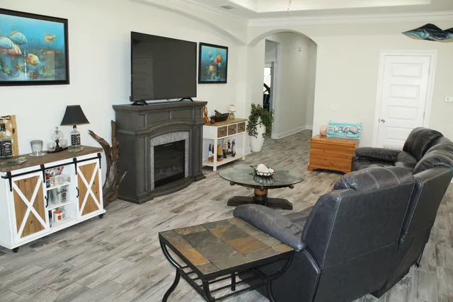 a kitchen with kitchen island a sink appliances and cabinets