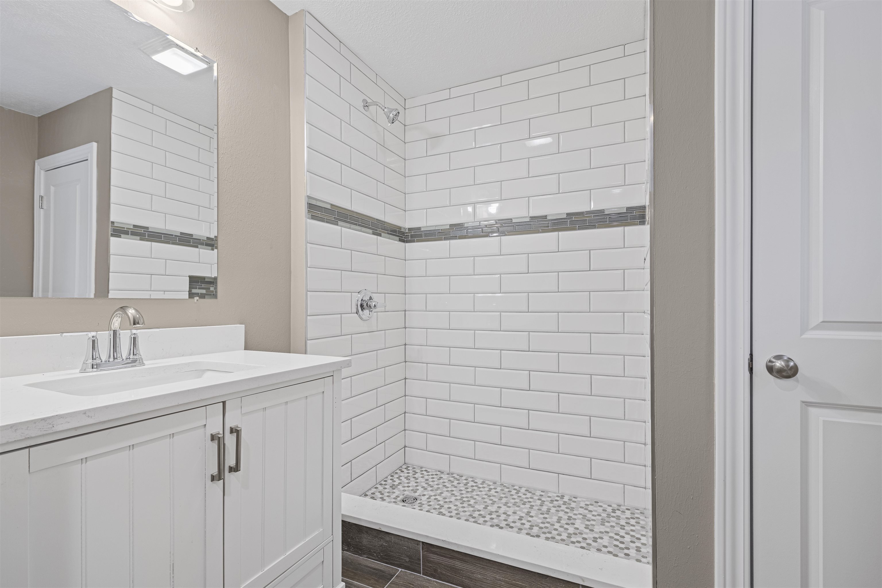 6872 Safford Road Rockford, IL 61101 - Photo 11 of 25 a bathroom with a shower and a sink