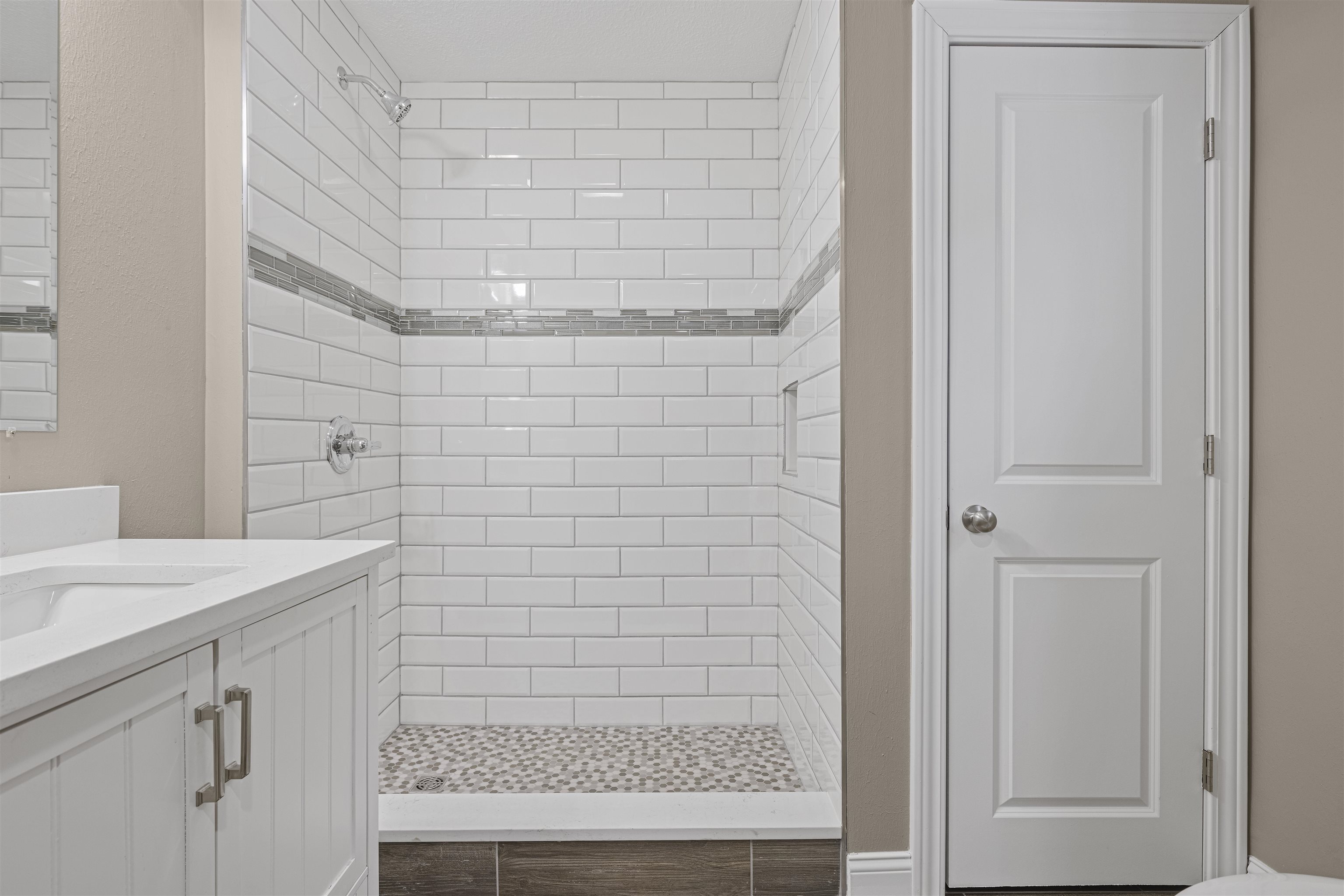 6872 Safford Road Rockford, IL 61101 - Photo 12 of 25 a bathroom with a shower and a sink