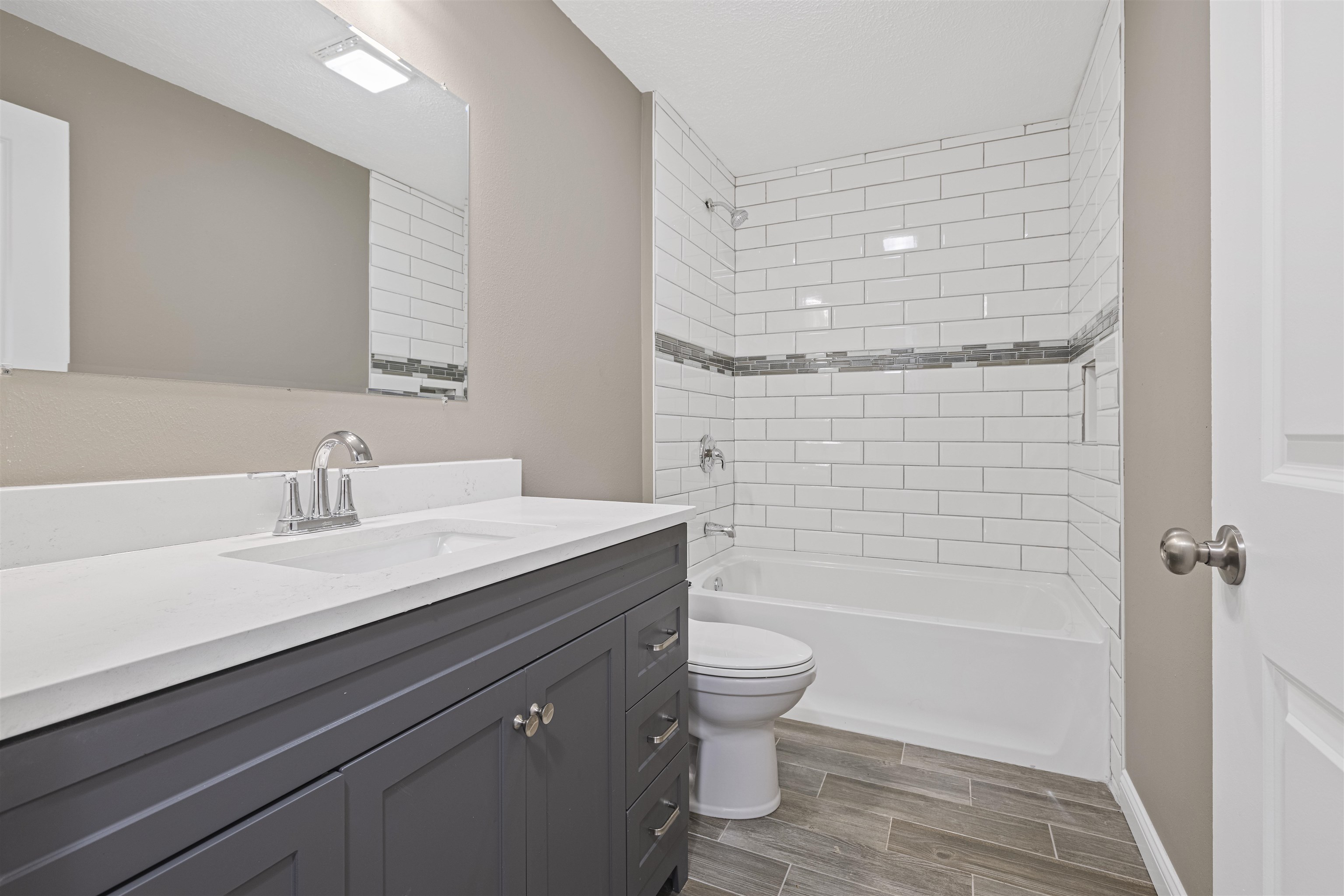 6872 Safford Road Rockford, IL 61101 - Photo 17 of 25 a bathroom with a sink a toilet and shower