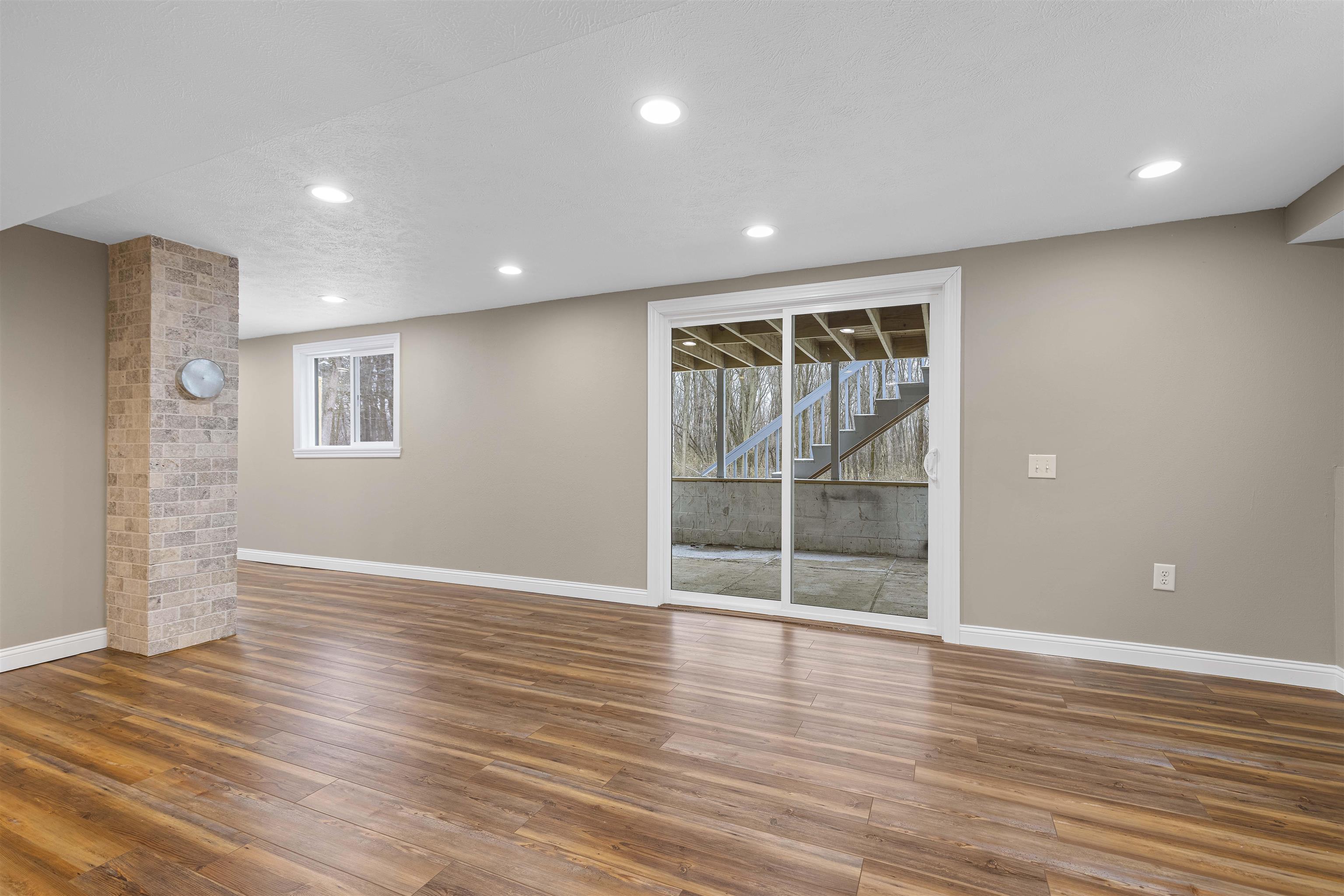 6872 Safford Road Rockford, IL 61101 - Photo 19 of 25 a view of an empty room with wooden floor and a window