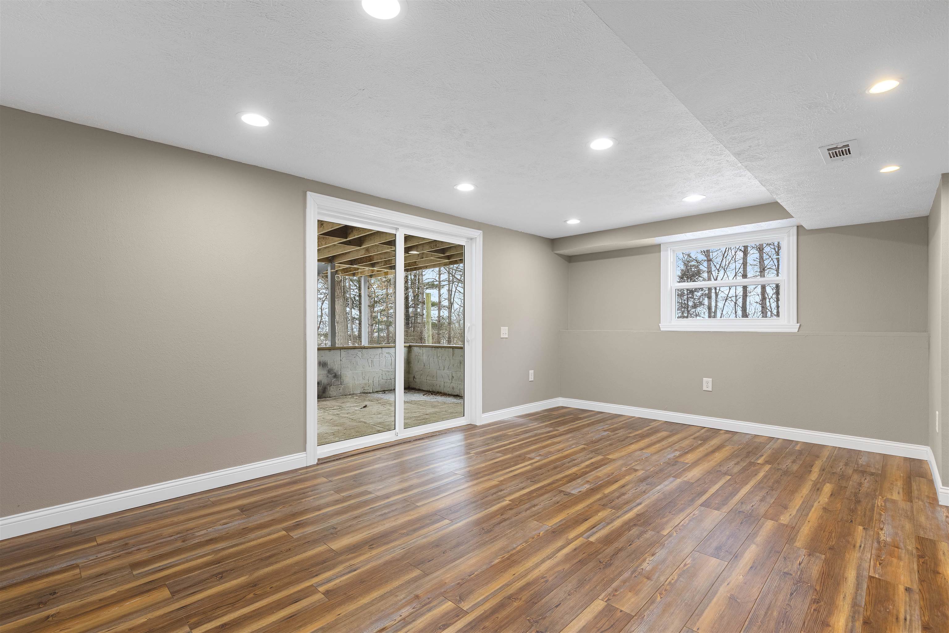 6872 Safford Road Rockford, IL 61101 - Photo 20 of 25 a view of an empty room with wooden floor and a window