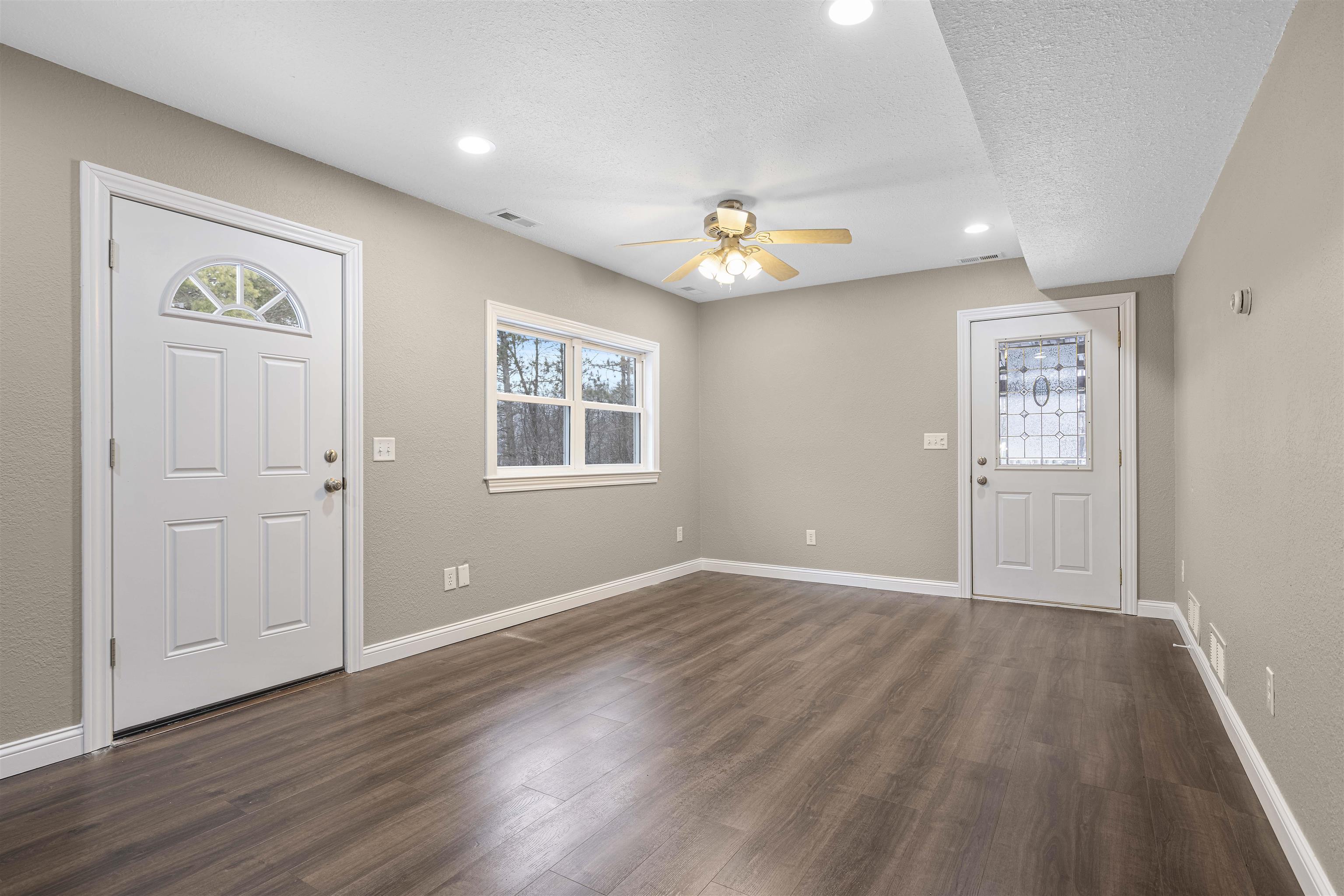 6872 Safford Road Rockford, IL 61101 - Photo 5 of 25 wooden floor in an empty room with a window