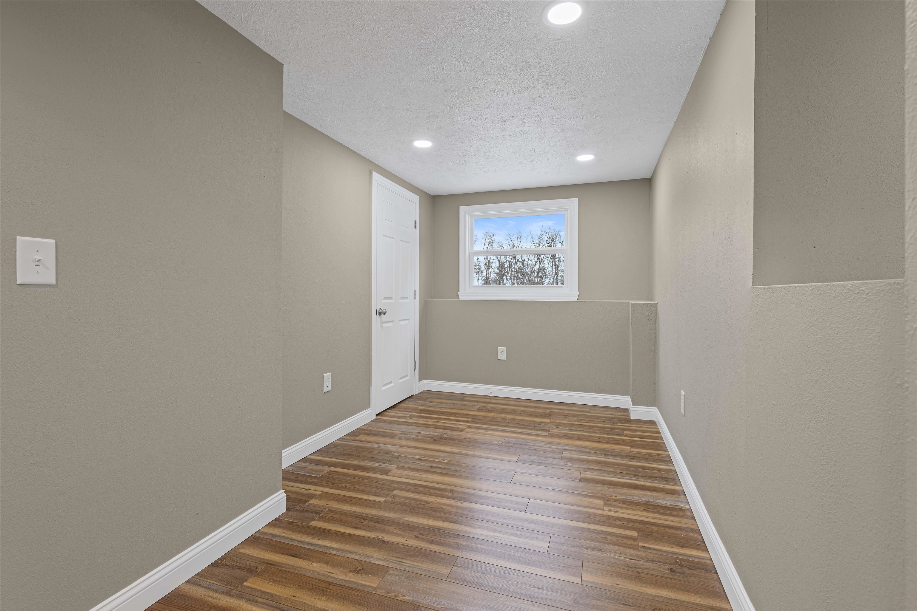 6872 Safford Road Rockford, IL 61101 - Photo 9 of 25 a view of room with window and hardwood floor