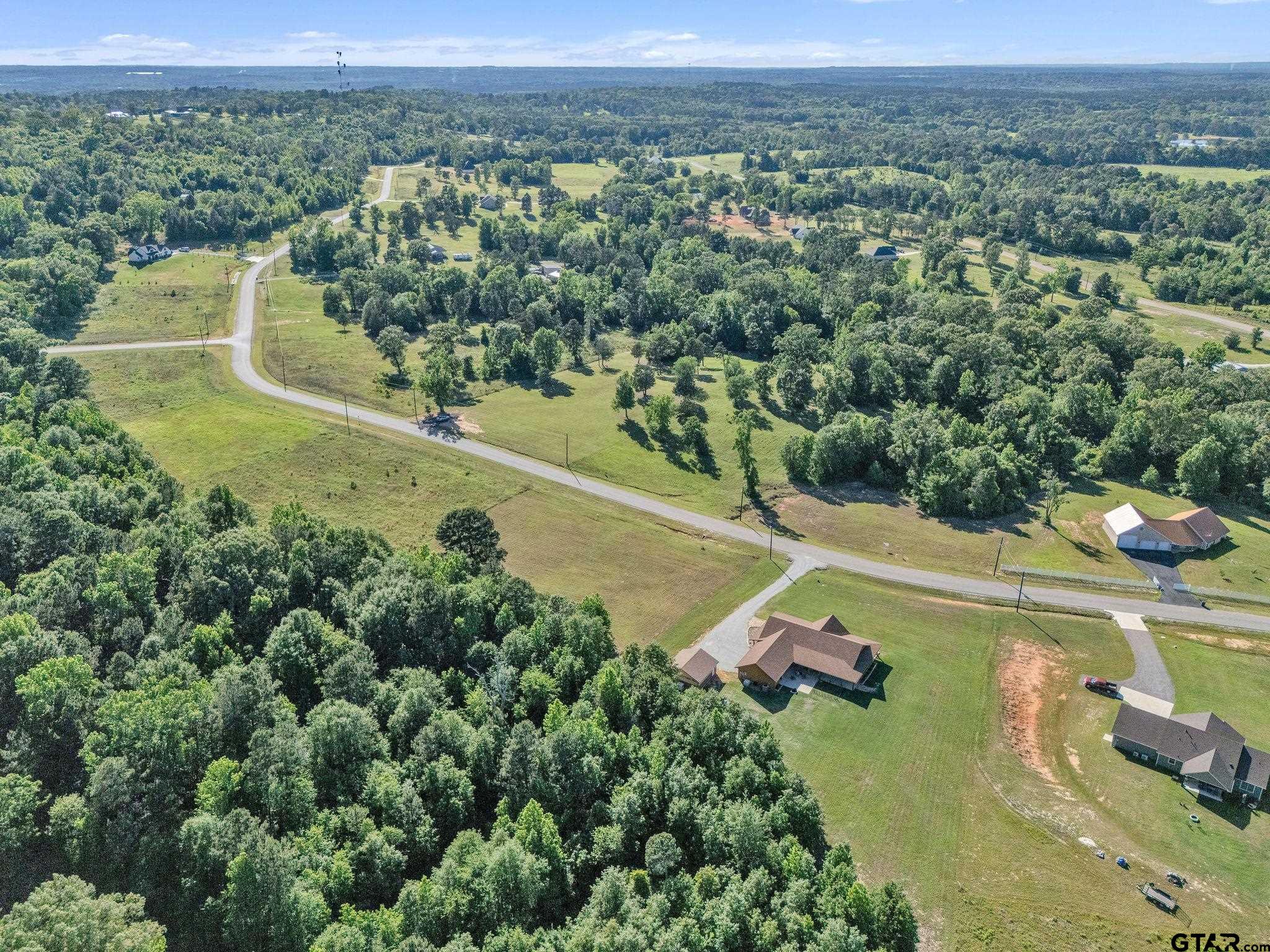 16808 Ridgeline Loop Winona, TX 75792 - Photo 6 of 12 an aerial view of a house with a yard