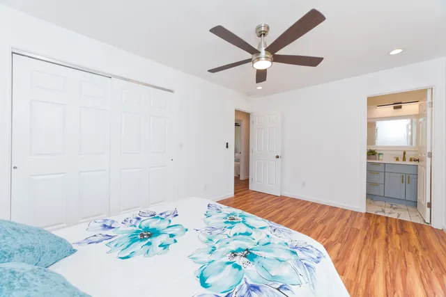 a bedroom with a bed and a table in it