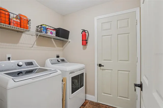 a utility room with dryer and washer