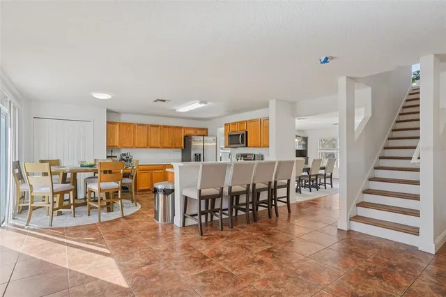 a view of a dining area with furniture window and outdoor view