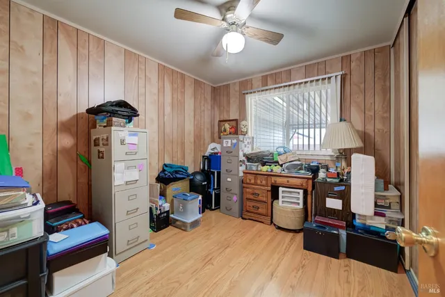 a kitchen with stainless steel appliances kitchen island granite countertop a refrigerator and a stove top oven