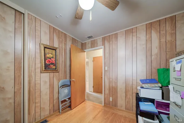 a very nice looking room with a large window and chair