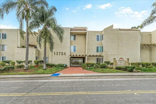 front view of a house with a garden