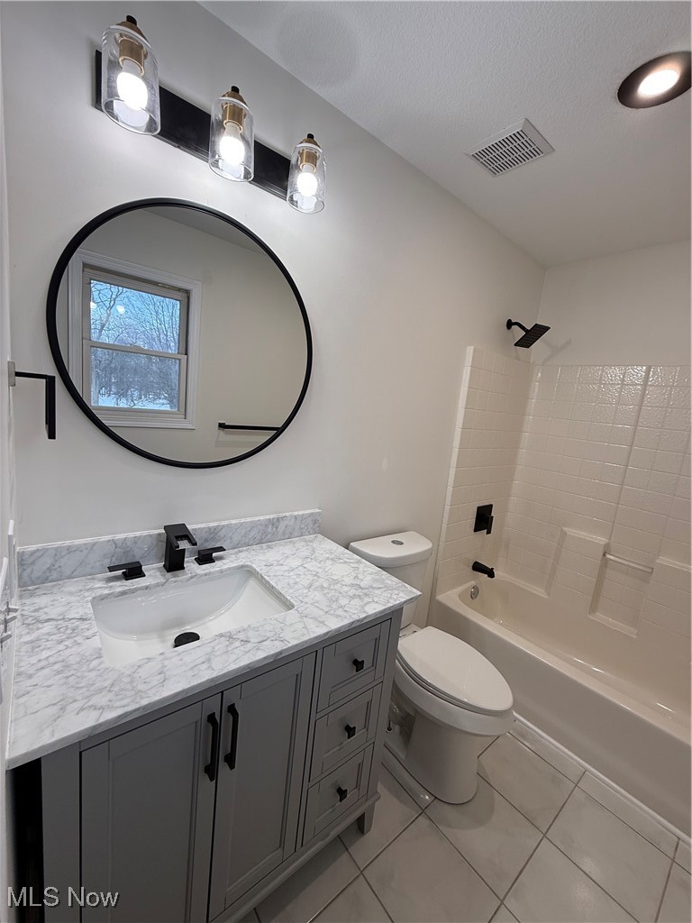 31295 Arthur Road Solon, OH 44139 - Photo 36 of 50 Full bathroom with tile patterned flooring, vanity, tub / shower combination, and toilet