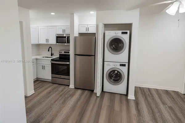 a kitchen with a washer and dryer